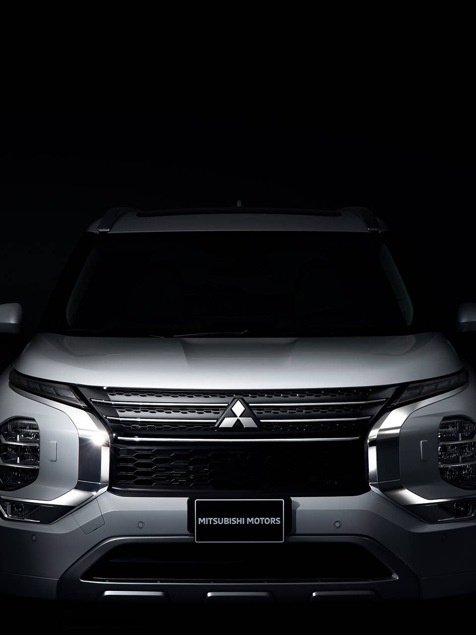 Front view of a white Mitsubishi Outlander SUV