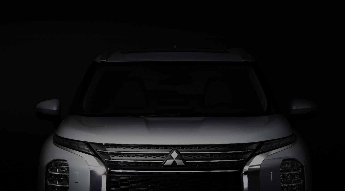 Front view of a white Mitsubishi Outlander SUV