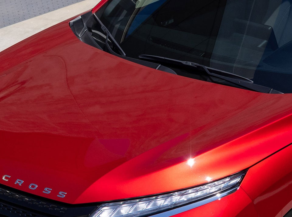 Close up of windshield and rain sensing wipes on a red 2023 / 2024 Mitsubishi Eclipse Cross Compact SUV
