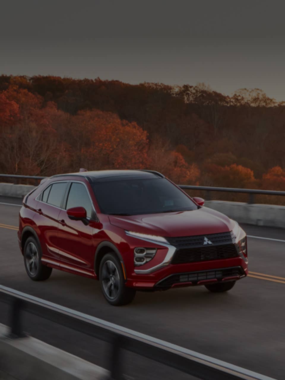 A red 2024 / 2025 Mitsubishi Eclipse Cross Compact SUV