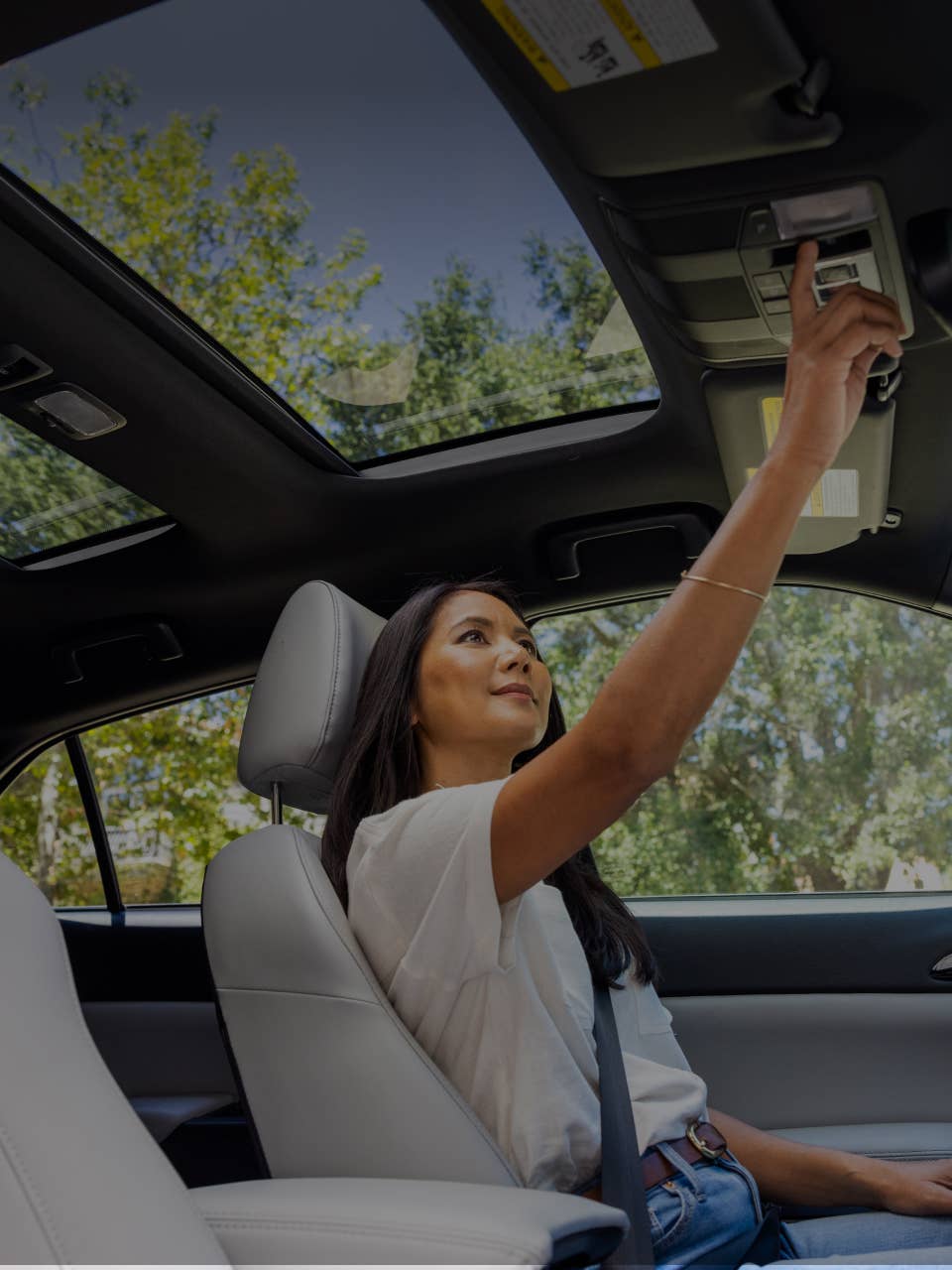 Driver adjusting the rearview mirror in the 2024 / 2025 Mitsubishi Eclipse Cross Compact SUV