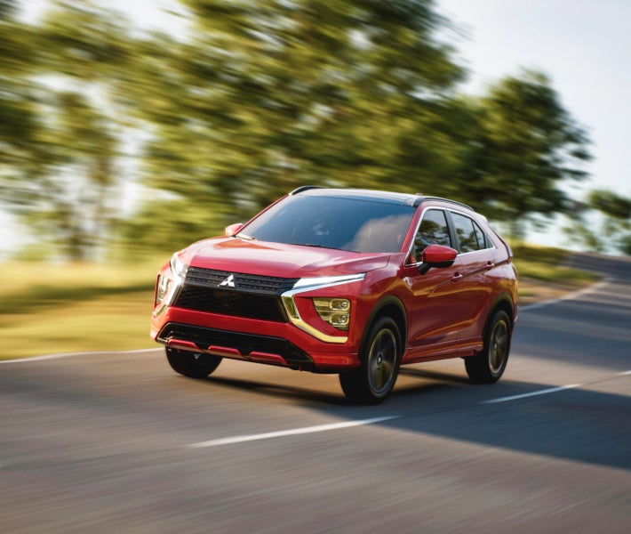 A red 2026 Mitsubishi Eclipse Cross Compact SUV with 1.5L direct-injection engine