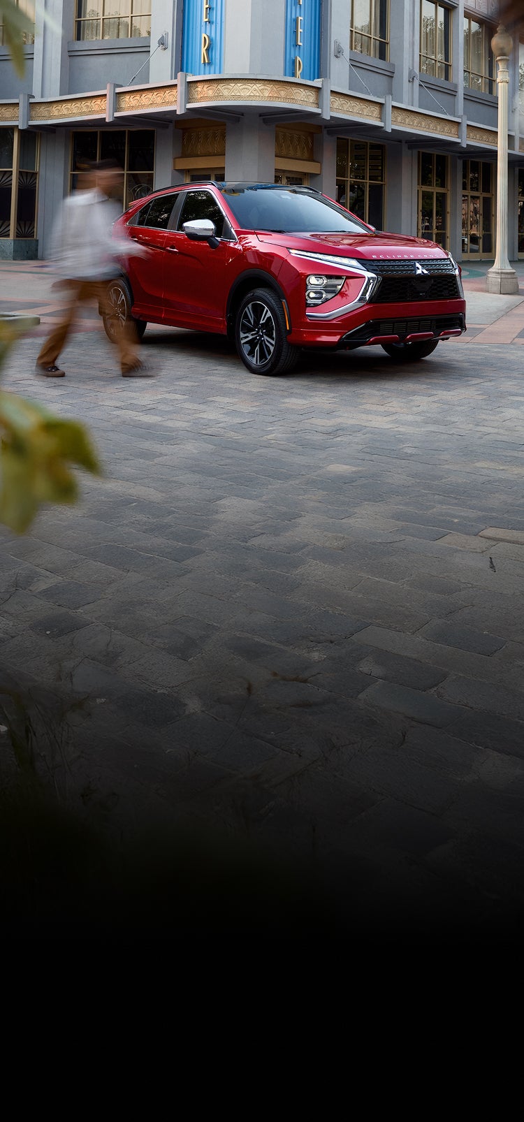 Angled view of a red 2026 Mitsubishi Eclipse Cross compact SUV parked