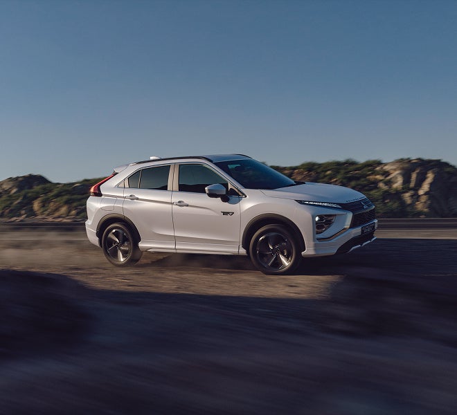 A white 2026 Mitsubishi Eclipse Cross compact SUV with 3 drive modes