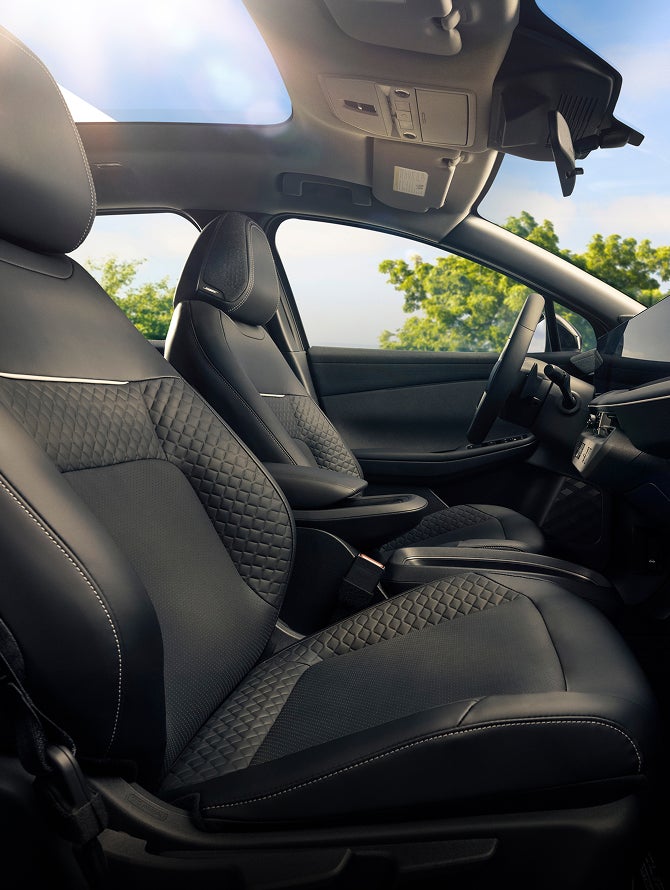 Side interior view of the 2027 Mitsubishi Eclipse Sportback EV front cabin.