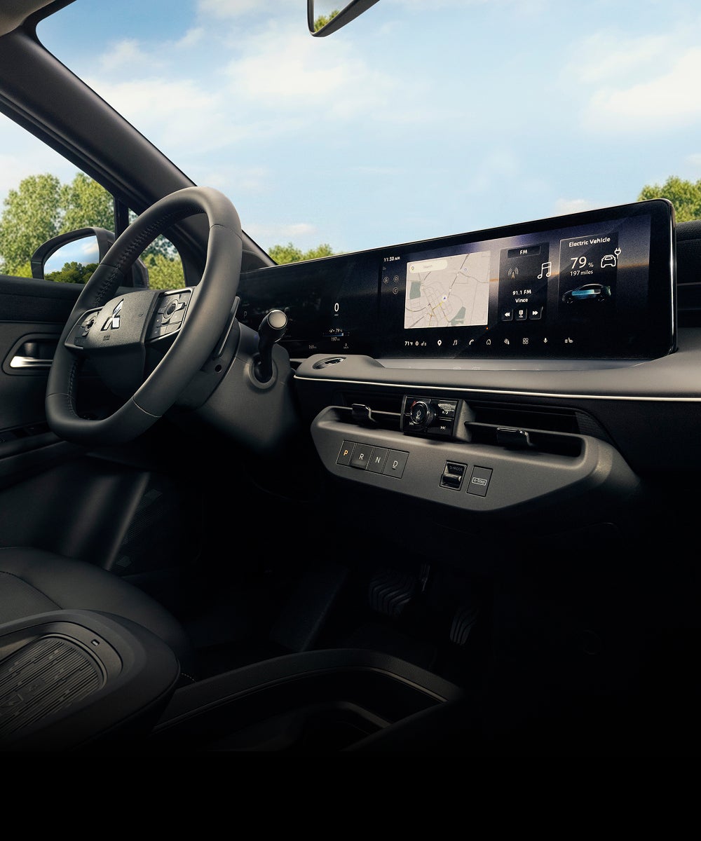Interior view of the front seats and windshield in the 2027 Mitsubishi Eclipse Sportback EV.