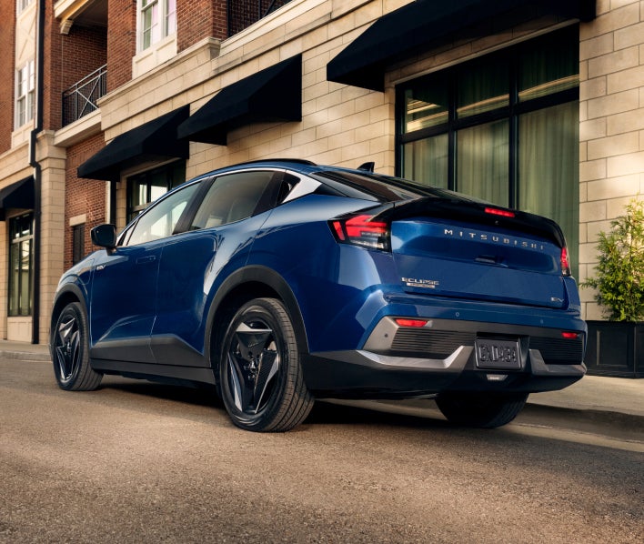 Rear three-quarter view of the blue 2027 Mitsubishi Eclipse Sportback EV.