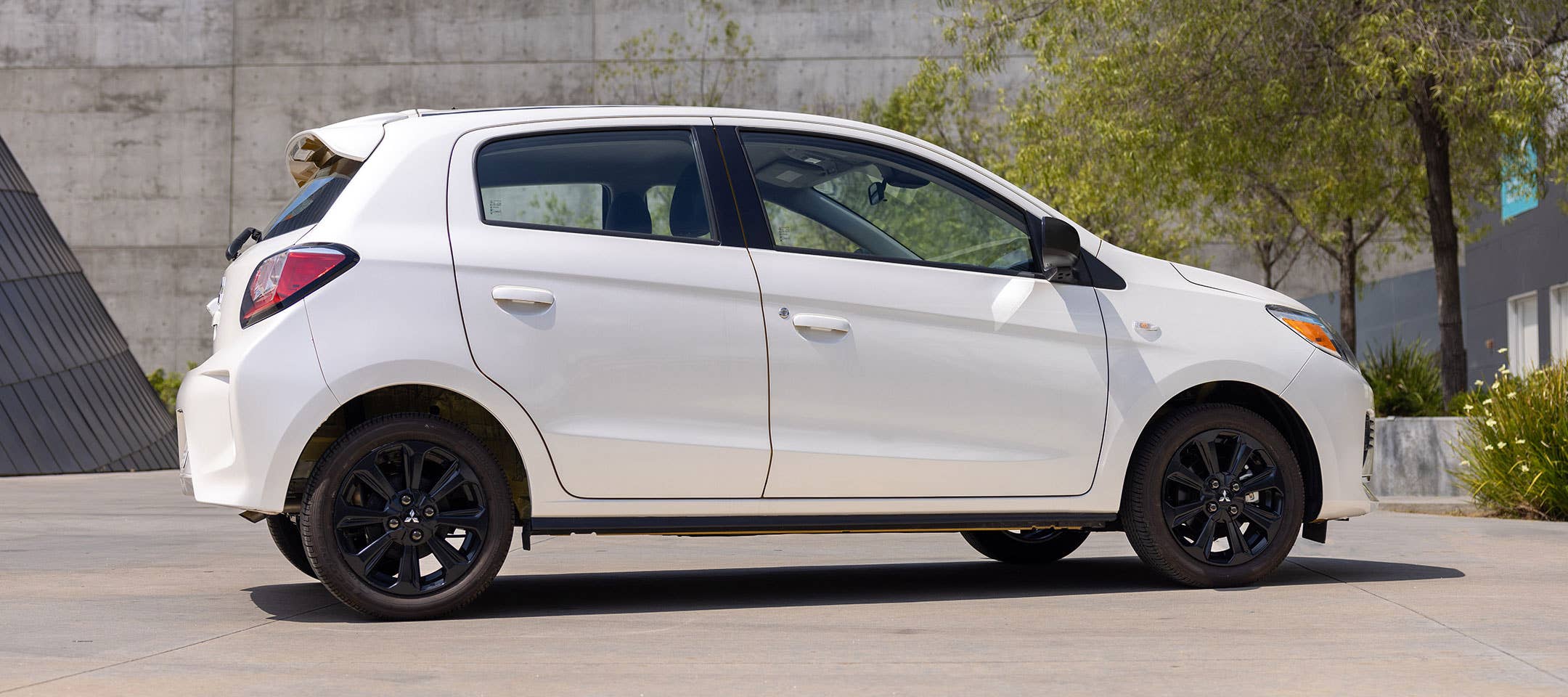 Angled view of a white 2023 Mitsubishi Mirage hatchback