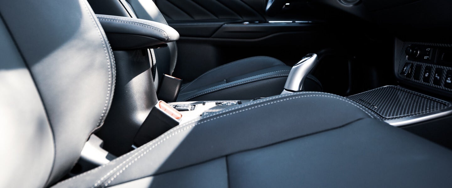 Light gray seating interior with white stitching in the 2022 Mitsubishi Outlander PHEV electric SUV