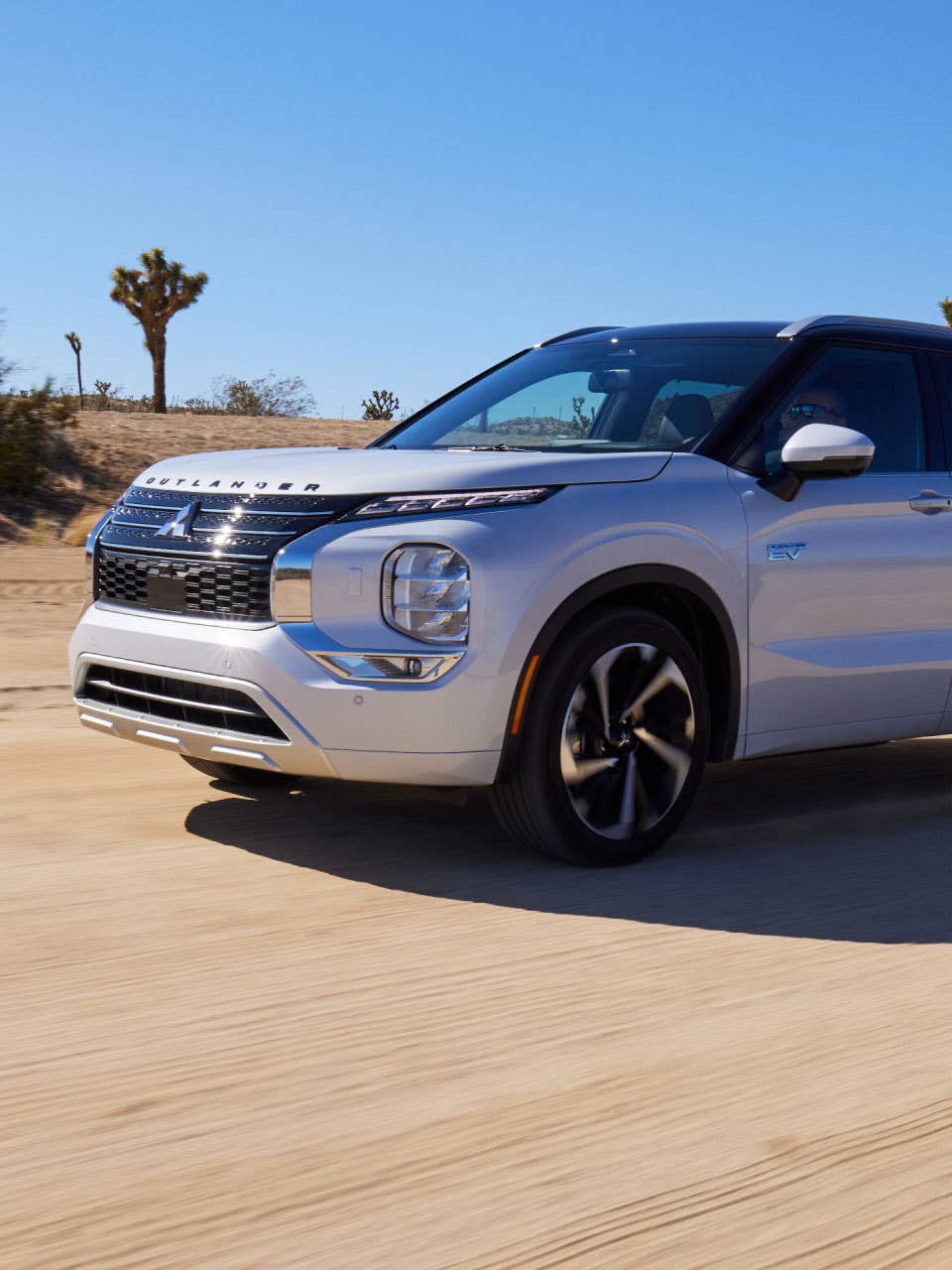 2024 / 2025 Mitsubishi Outlander PHEV SUV driving in the desert
