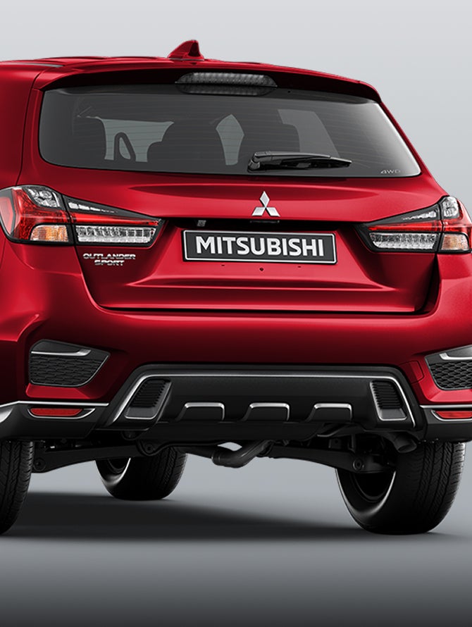 Rear view of red 2026 Mitsubishi Outlander Sport SUV 