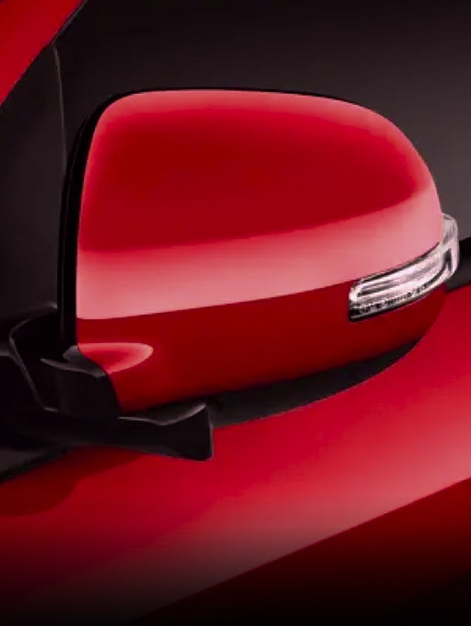 Close up of red 2026 Mitsubishi Outlander Sport SUV side mirrors