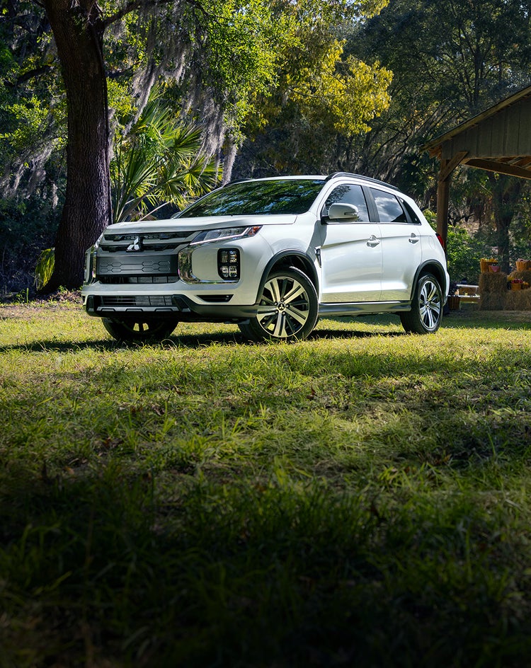 Front view of a 2026 Mitsubishi Outlander Sport outside of a flower market