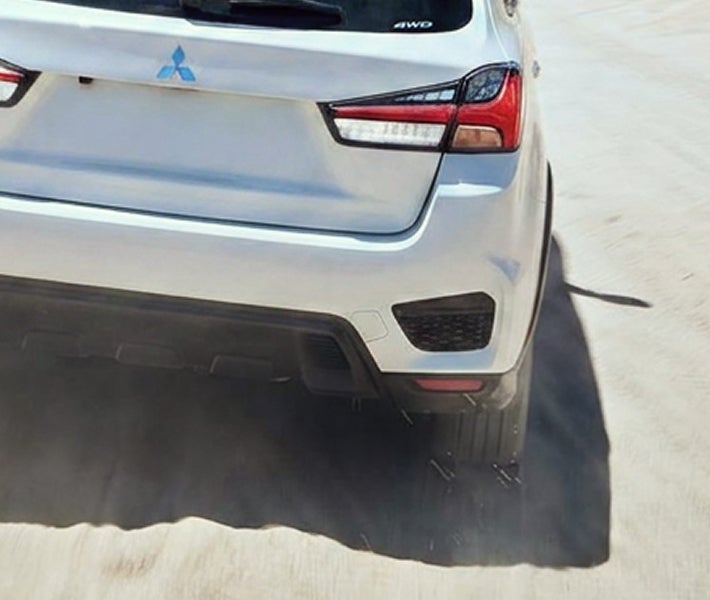 Detailed shot of the rear view of a white 2026 Mitsubishi Outlander Sport SUV