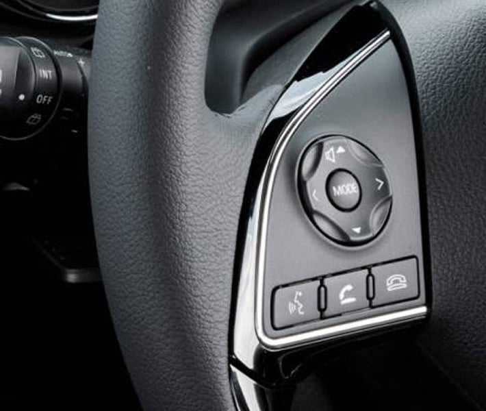 Close up on 2026 Mitsubishi Outlander Sport SUV Bluetooth controls on steering wheel