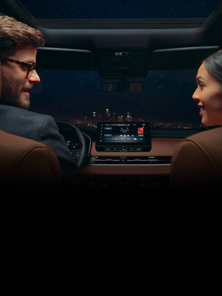 Passengers listening to the Yamaha sound system in the new 2025 Mitsubishi Outlander SUV