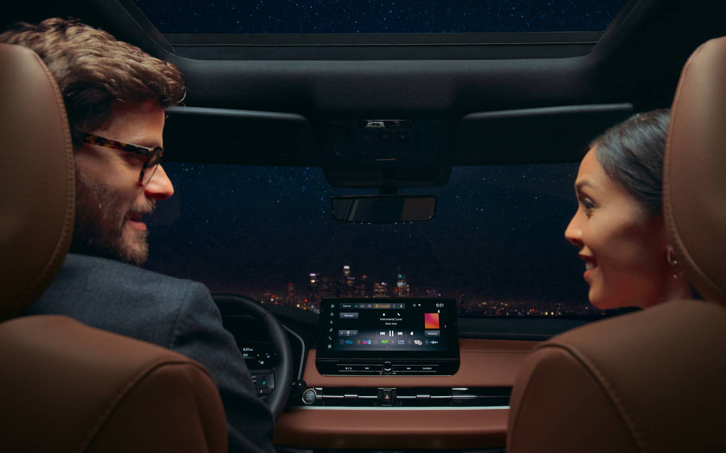 Passengers listening to the Yamaha sound system in the new 2025 Mitsubishi Outlander SUV