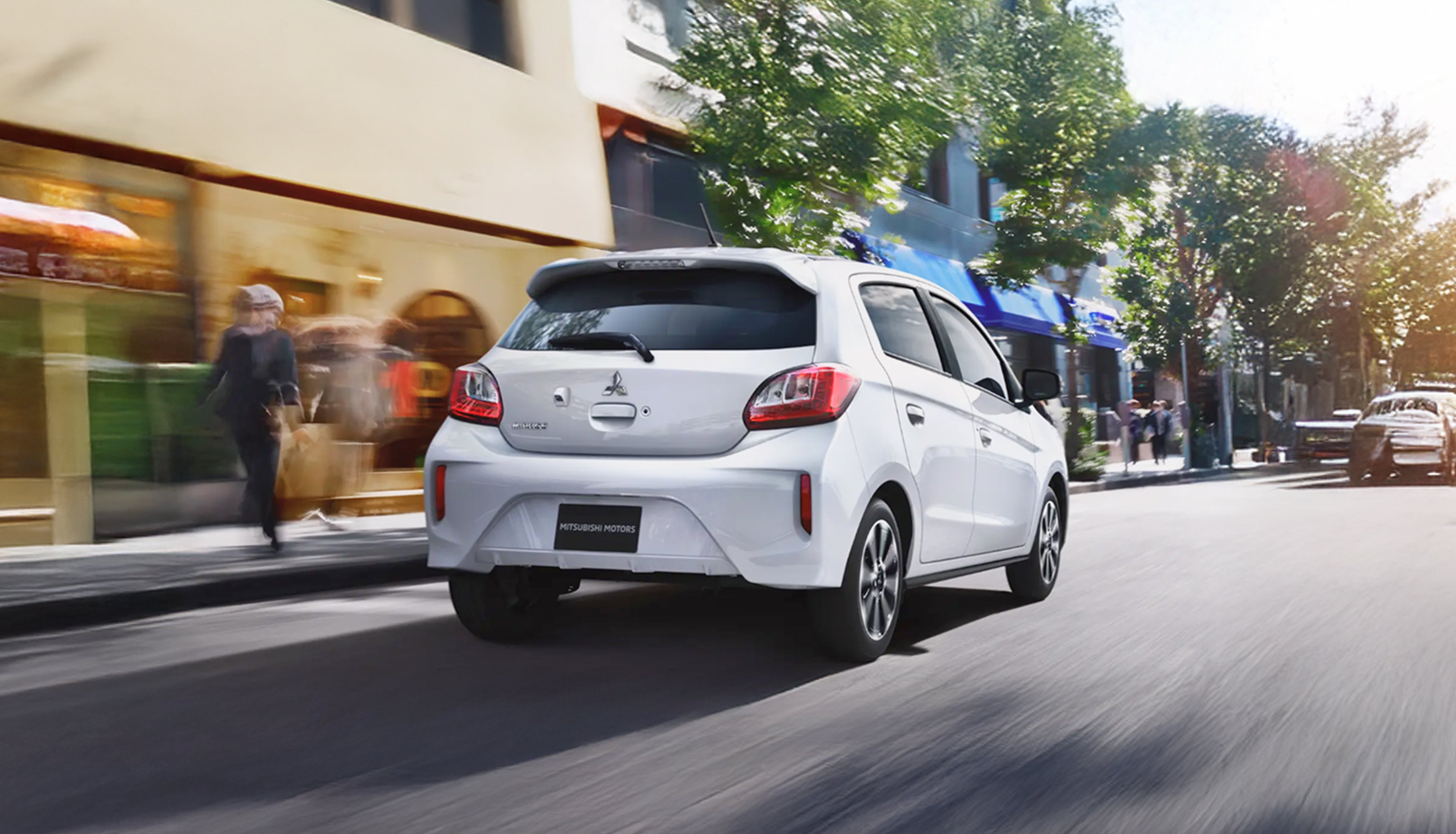 Rear View of white mirage driving on street