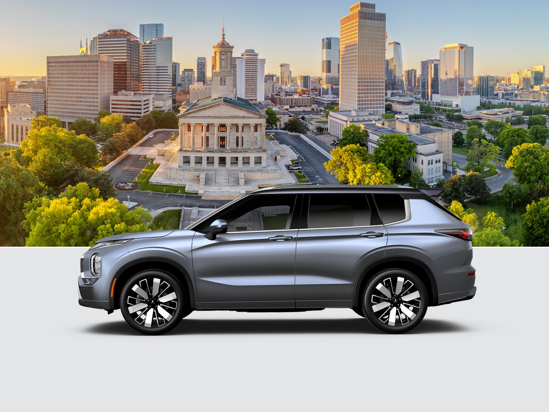 A grey 2026 Mitsubishi Outlander 3 row SUV on a Nashville background 