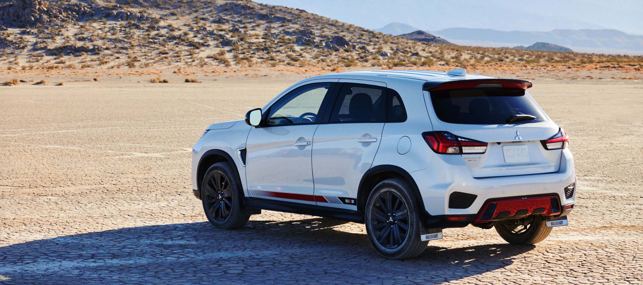 Angled back view of a 2023 Mitsubishi Ralliart Edition Outlander Sport SUV in the desert